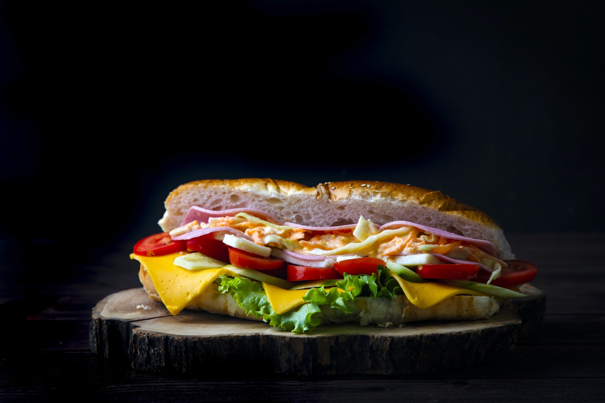 Delicious looking cold sandwich served with coleslaw sauce.