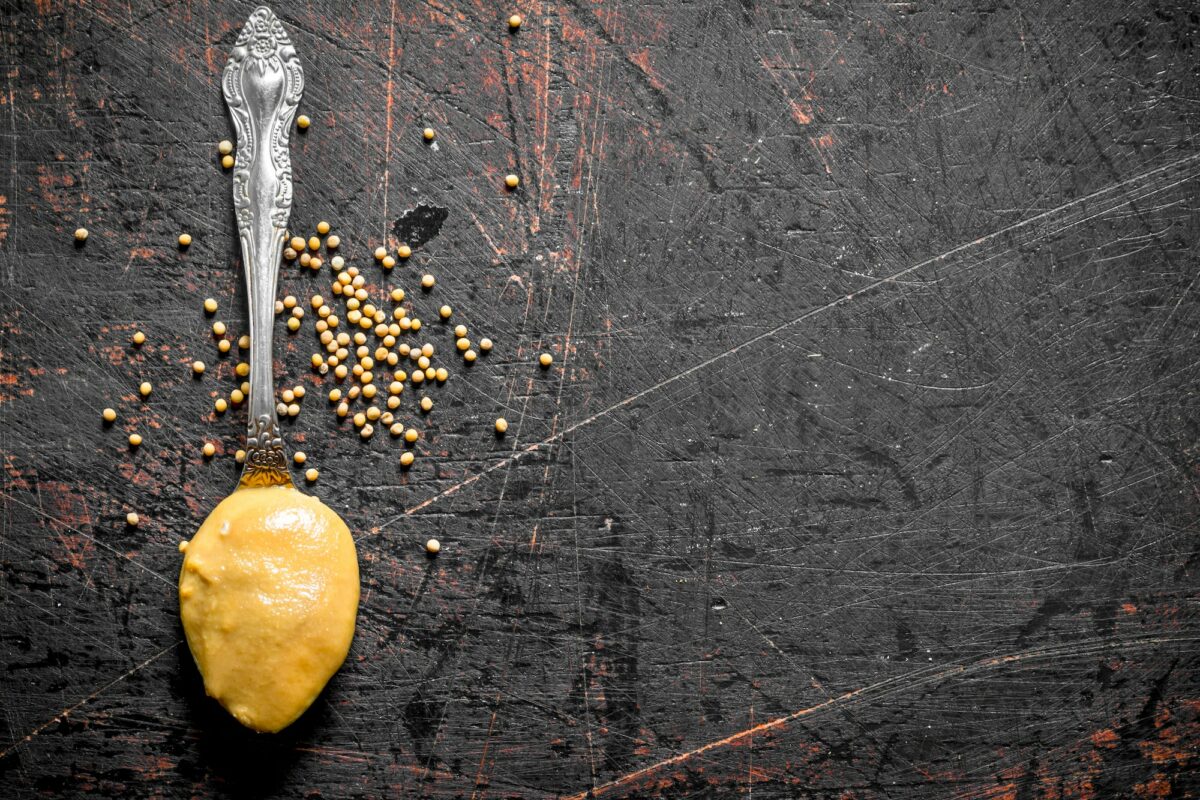 Mustard in spoon.